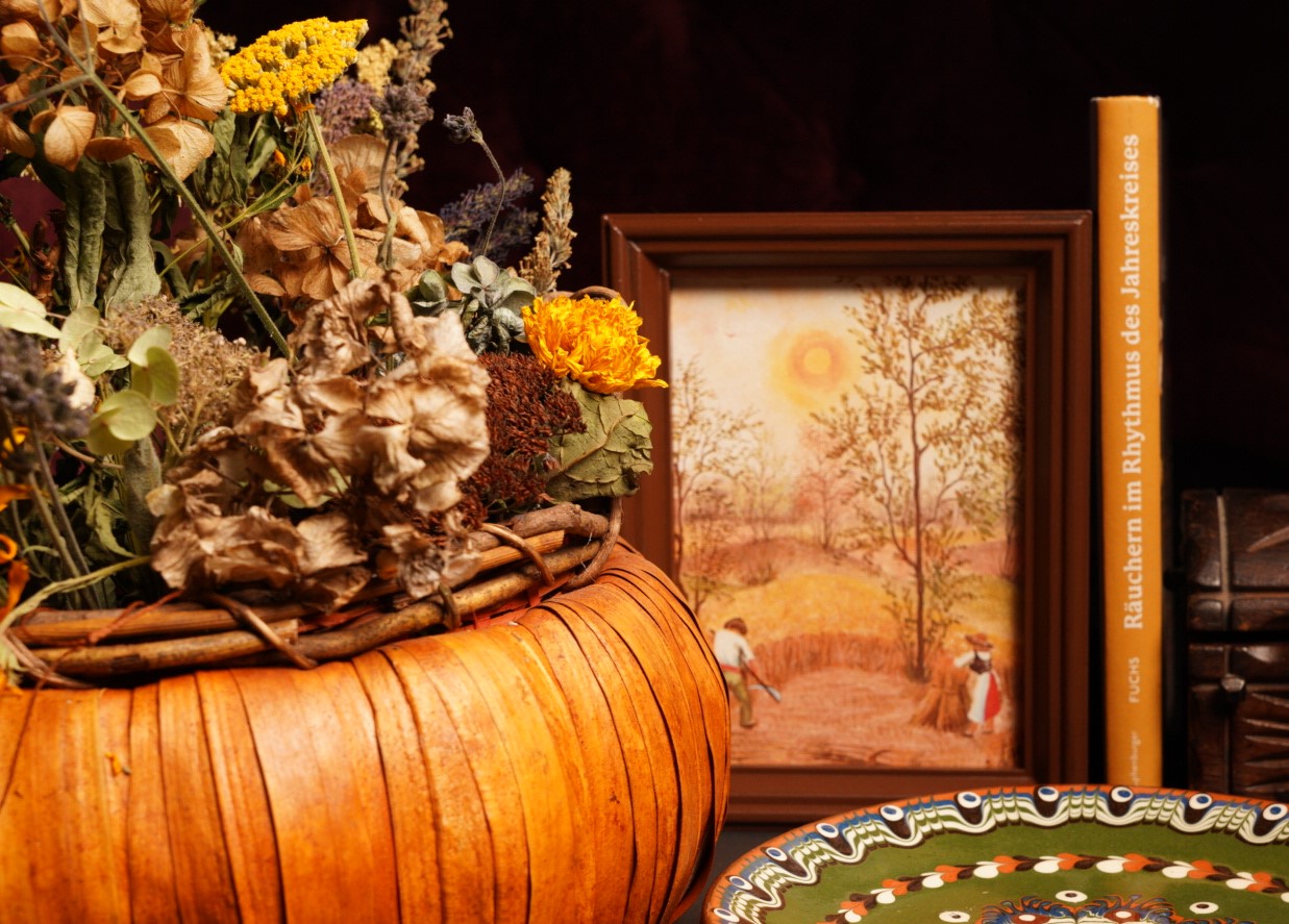 fall scene with pumpkin basket book and flowers